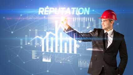 Young businessman with helmet drawing on virutal screen