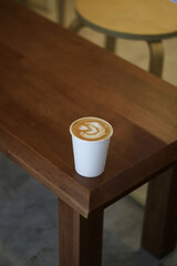 coffee paper cup on the wooden table