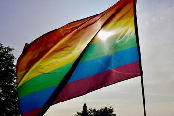 Pride flag blowing in the wind downtown
