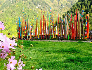   flag with prayers according to Asian religions in Tibet.Blessings for long life and wealth. It's believed when the wind moves prayer flags, all blessings become activated.
