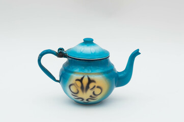 Mid-century modern blue enameled kettle with spray painted pattern