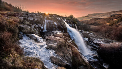 The Loup o Fintry waterfall on the River Endrick is a large 94ft waterfall. It is situated in Stirlingshire and not far from the village of Fintry, Scotland