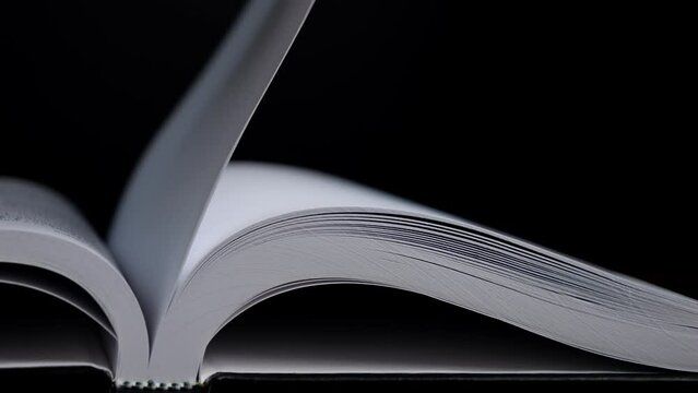 4K-Slow motion of book flip pages moving from side to side, Education and business concept.