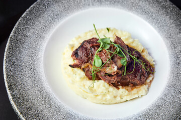 Veal with mashed potatoes and herbs