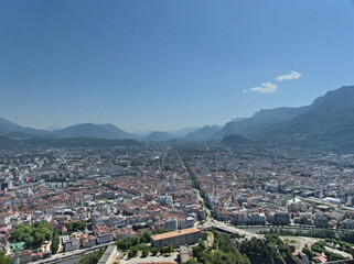 Obraz premium Grenoble, France - June 2022 : Visit the beautiful city of Grenoble in the middle of the Alps from the Bastille