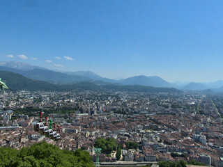 Fototapeta na wymiar Grenoble, France - June 2022 : Visit the beautiful city of Grenoble in the middle of the Alps from the Bastille