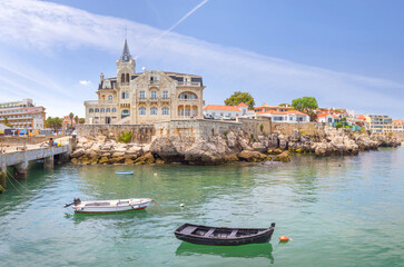 Cascais near Lisbon, seaside town. The house in the center is the Seixas Palace, built on the ocean at the beginning of the 20th century. Portugal - obrazy, fototapety, plakaty