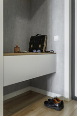 Entrance hall in a new apartment with a white wardrobe
