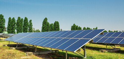 Solar panel of a solar park. Photovoltaic modules of a Solar energy power plant producing sustainable energy to prevent climate change.