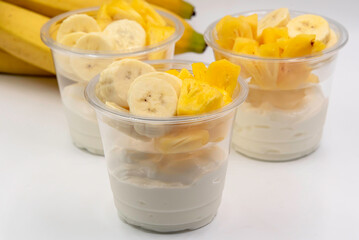 Bowl of fresh yogurt with fruit served for good health.