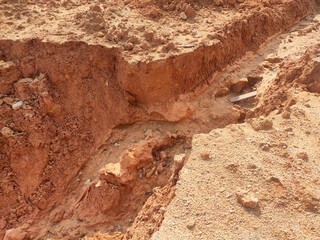 Erosion on the ground and slopes is caused by rainwater. The soil structure becomes weak and there is a landslide. Safety measure has been taken in some area.