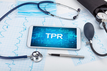 Close-up view of a tablet pc with medical abbreviation