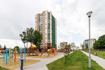 Children's playground in the courtyard of a multi-storey residential building