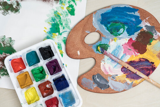 palette with brushes and paints