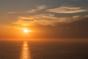Naklejka na ściany i meble Sunset over the ocean
