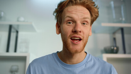 Excited man talking virtual meeting closeup. Impressed motivational speaker