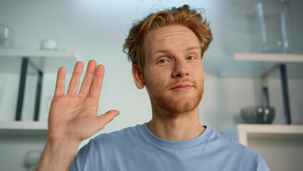 Man waving video chat closeup. Online teacher finishing remote class saying bye