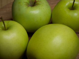 Renet simirenko green apples, top view, close-up. Macro shot of fruit.