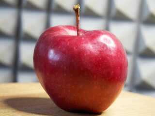 One large red apple. Apple of the Red Chief variety.