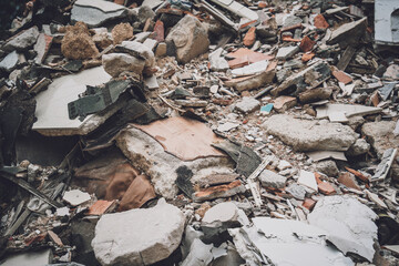 Waste plastic bottles and other types of waste at the ground