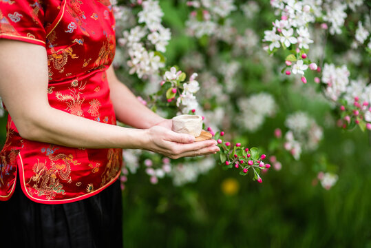 Asian woman in hands with tea, healthy lifestyle concept.