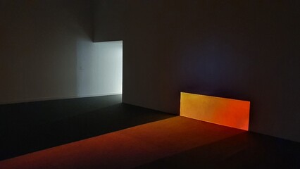a space with yellow, red, black light