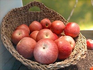 red apples in a wicker basket