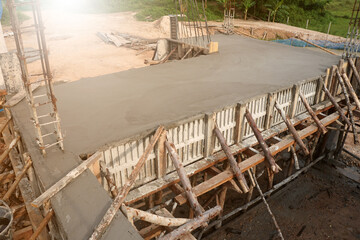 Formwork of concrete slab and beams and supporting beams on construction site.