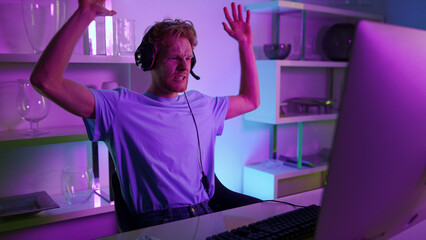 Stressed gamer playing esport tournament closeup. Angry man losing video game