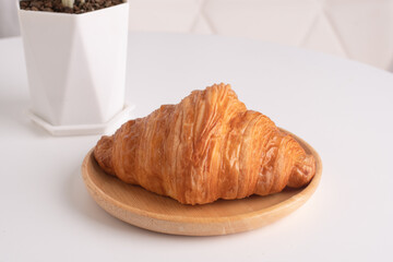 plain crossants. fresh baked on plate on table