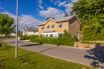 Beautiful summer landscape view of modern village houses. Sweden.