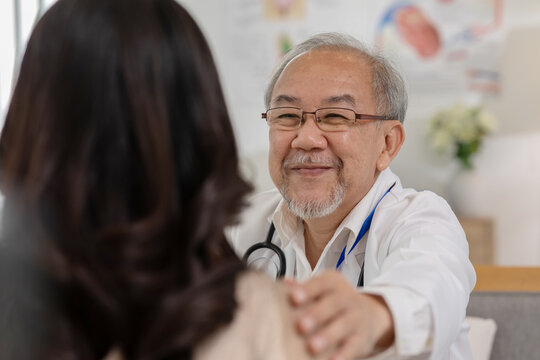 Senior Doctor Giving Hope And Encourage To Patient Woman At Hospital. Professional Asian Senior Doctor Be Friendly Warmth Ready To Treat Consult Or Take Care Patient At Private Clinic. Mental Health