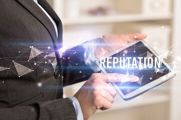 Close up hands using tablet