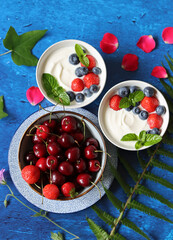 Sweet cherry on a table. Vibrant color of summer fruit. Refreshing summer snack. Top view photo of cherry. 