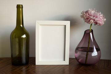 frame with space for text, decoration with a vase of flowers and bottles