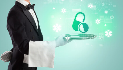 Handsome young waiter in tuxedo holding healthcare icons on tray