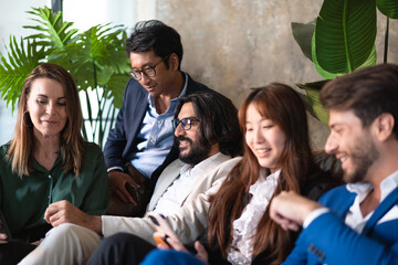 Business team work break talking together in a corporate relaxation area