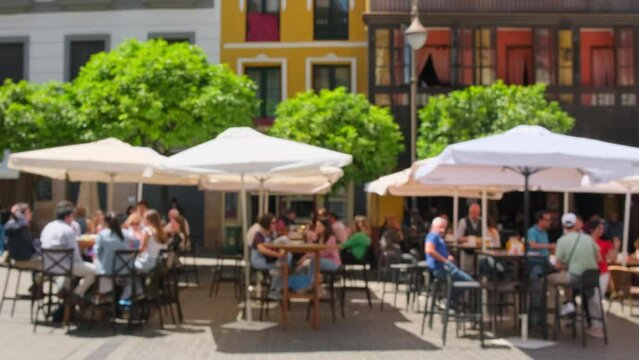 Defocused view of the traditional European outdoor cafe in summer