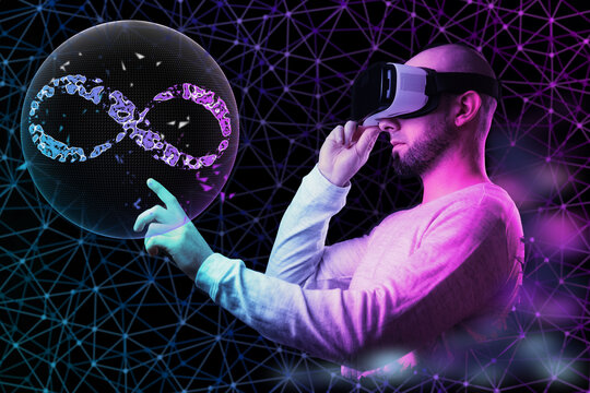 Portrait of young man in VR glasses point on 3D simulation of sphere with sign of metaverse. Black background with neon abstract mesh. The concept of virtual reality and cyberspace