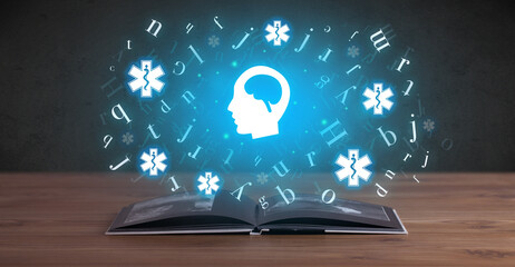 Open medical book with health icons above