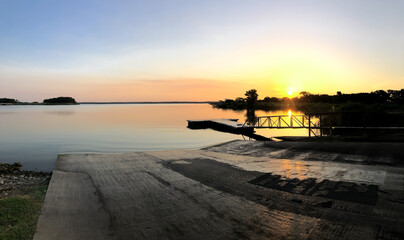 Panorama view small waves near the shore of Grapevine Lake with fishing pole standing on rod...
