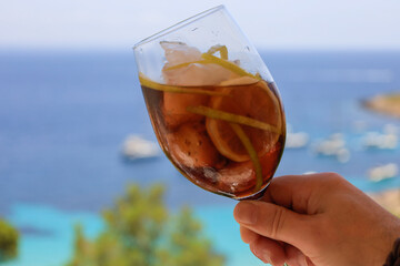 hand holding a glass