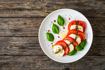 Caprese salad on wooden board
