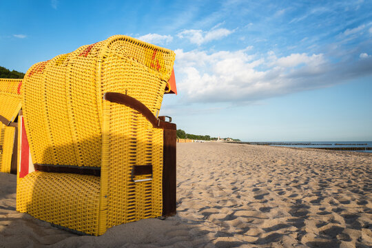  Sunset at the baltic sea with beach chairs