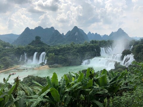 Detian waterfalls in very beautiful green mountains with a cloudy sky