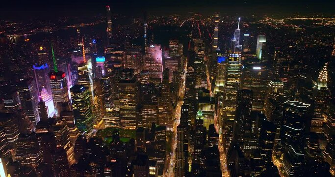 Sparkling glamorous New York, USA at night. Fantastic skyscrapers towering over the metropolis with crazy traffic. Aerial perspective.