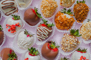 Close up, top view: many different fresh chocolate covered strawberries - selective focus. Romantic, holiday, gift, confectionery and Valentine Day concept
