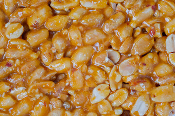 Top view: Gozinaki - caramelized nuts fried in honey - orange granola peanut bar - close up, macro. Oriental sweet, traditional Georgian cuisine, gastronomy and food concept