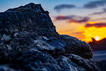 reykjanesbaer area near keflavik in Iceland, lava field stone in sunset