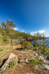 Fototapeta na wymiar Rocky bay on the island of Valaam. The rocky shore of the island of Valaam. Nikonovsky Cape.